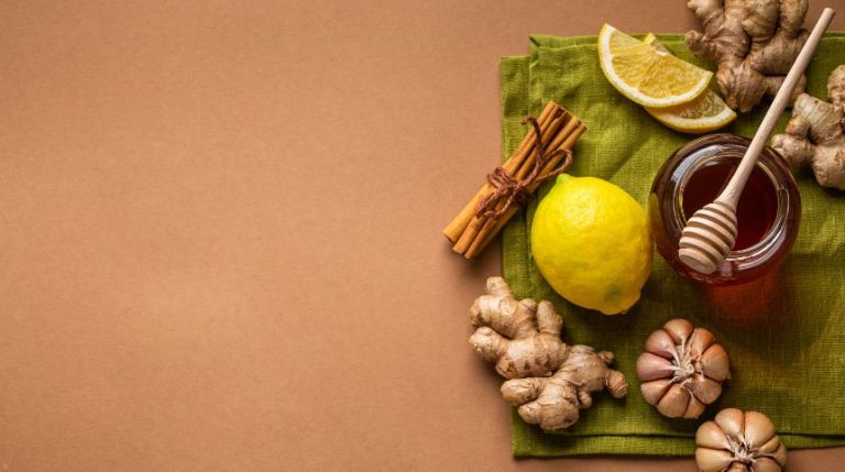 Lemon, ginger and honey on a brown background.
