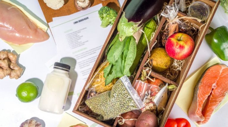 A meal kit delivery box, showcases lots of fresh ingredients.