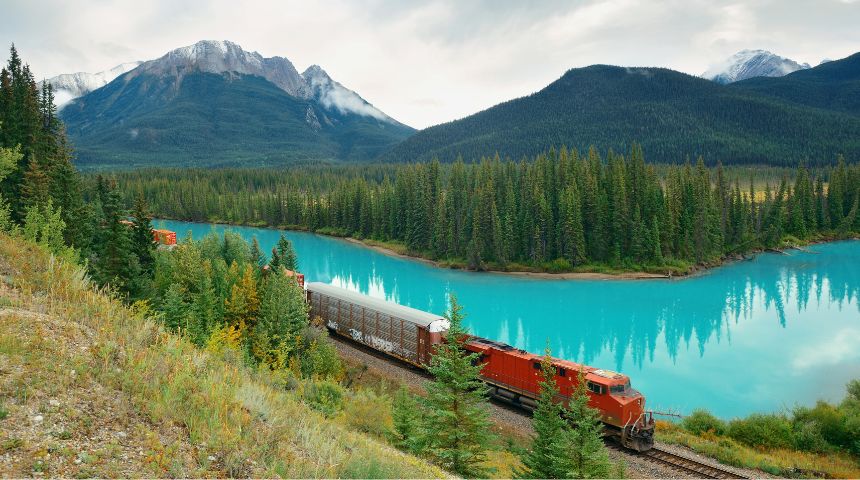 A passenger train going through the Canadian Rocky mountains.