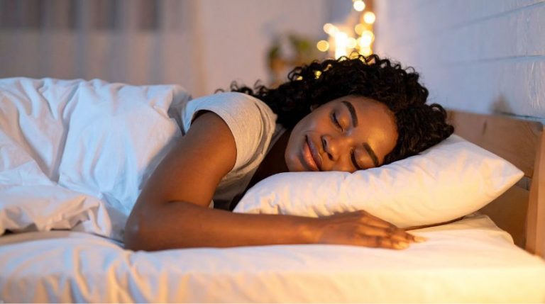 A woman sleeping on her side.